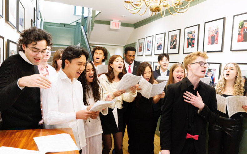 vocalists singing in a hallway